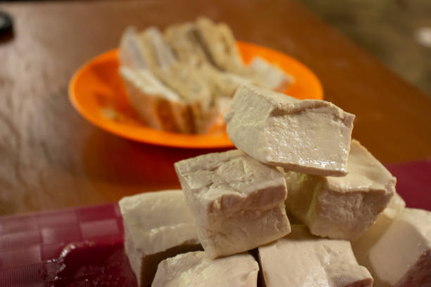 istock Tempe and tofu in their respective containers on a chocolate table 1438330556