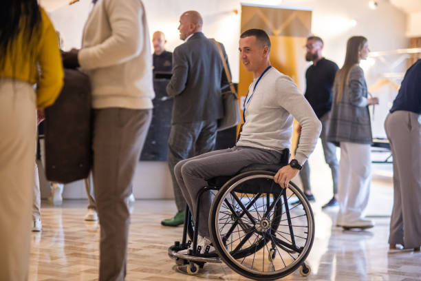istock Disabled businessman in a hotel lobby before a business conference 1438332461