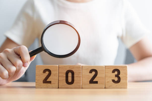 istock 2023 block with magnifying glass. SEO, Search Engine Optimization, hiring , Advertising, Idea, Strategy, marketing, Keyword, Content and New Year start concepts 1438332506