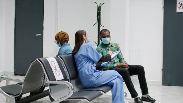 istock Senior woman with face mask attending checkup appointment 1438333136