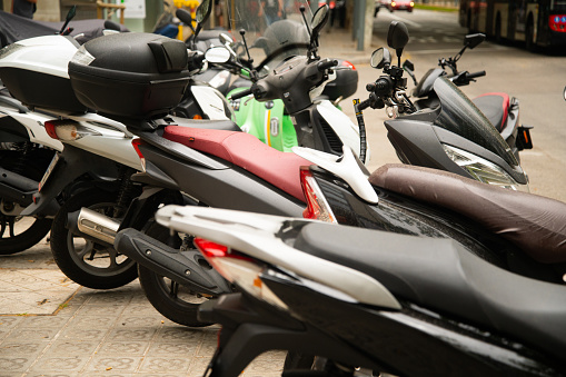 Detail of a large number of scooters in a city