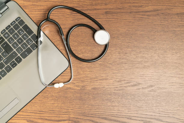 istock stethoscope on laptop with space for text. Private health concept 1438335884