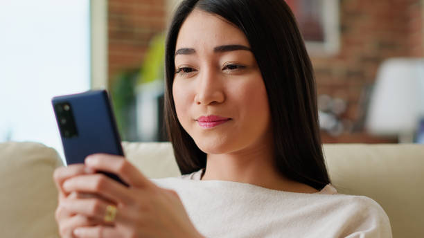 istock Cheerful young adult student chatting with colleague about next project assignment 1438335937