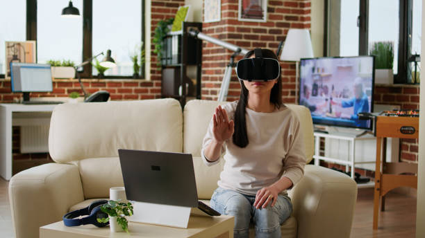 istock Woman wearing virtual reality headset scrolling through metaverse cyberspace 1438335956