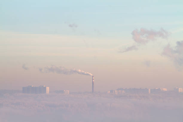 istock smoke is spreading from the chimney over the city 1438336503