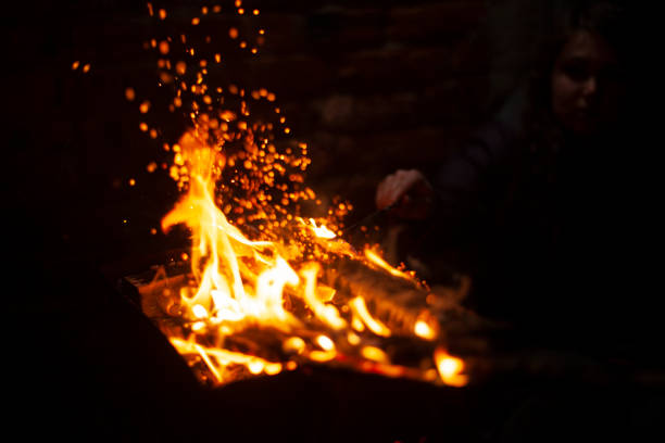 istock Flames of pyre. Fire in dark. Burning firewood. 1438337922