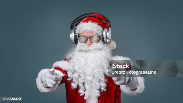 Cool Santa Claus Is Listening Music In Headphones Stock Photo - Download Image Now - Santa Claus, Christmas, Rock Music