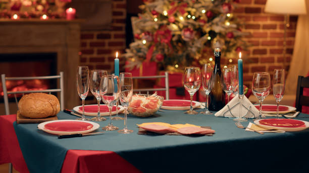 istock Empty interior of festive traditional Christmas dinner table with authentic decorative cutlery and dinnerware 1438339785