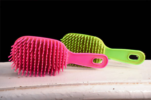 istock Hair brush colored pink and green 1438339847