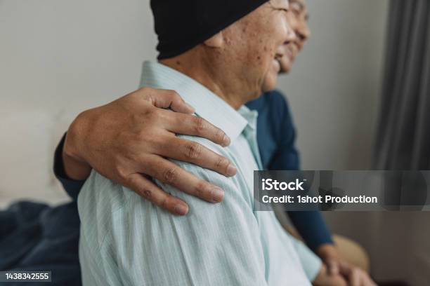 Father And Son Enjoy Talking In Bedroom Stock Photo - Download Image Now - Cancer - Illness, Patient, Lifestyles