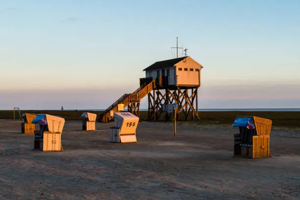 Stilt house on the beach at the North Sea