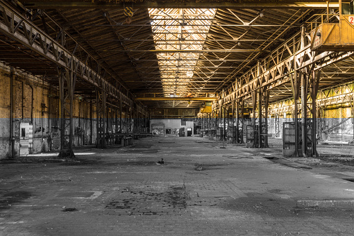 Interior of empty industrial abandoned, old factory. Vintage effect applied. 3D rendered image.