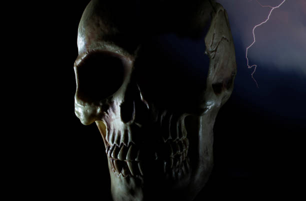 skull on a dark background with lightning behind - the eye of the storm thunderstorm storm cloud imagens e fotografias de stock