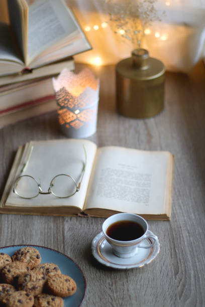 istock Cookies, Tea, Books and Candle 1438345782