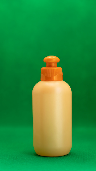 orange container on green background