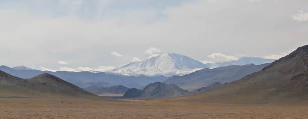 istock Wide angle shot of the mountains under a clouded sky 1438350180