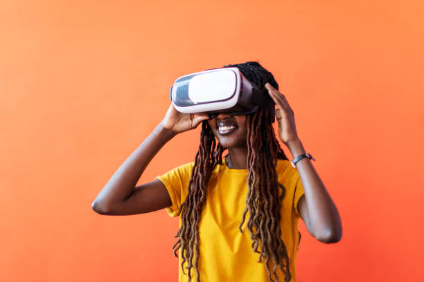 istock Black young woman in virtual reality glasses 1438350584