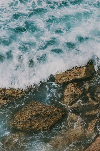 istock Blue Waves And Brown Rocks Shot From Above In Australia 1438350623