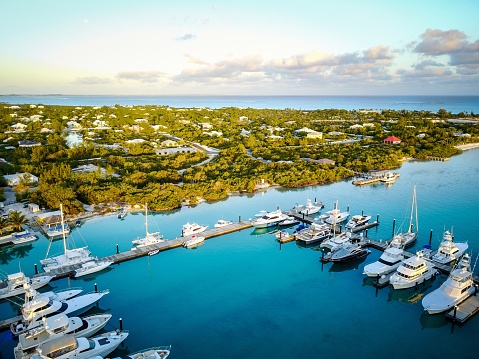 The marina at sunrise with luxury yachts in the Turks and Caicos islands