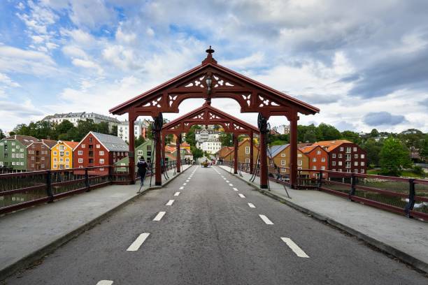 istock Old Town Bridge surrounded by buildings under a cloudy sky in Trondheim in Norway 1438353028