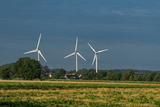 istock Field with windmills against a blue sky 1438353128