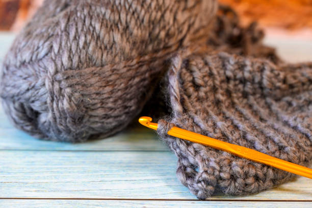 istock Yarn ball and a crochet hook. 1438353158