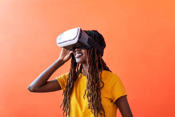 istock Black young woman in virtual reality glasses 1438353226