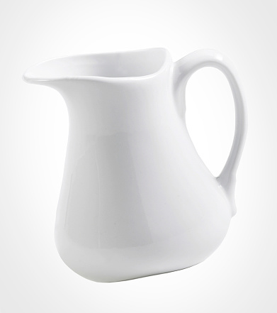 White milk pitcher isolated on white background