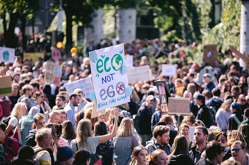 Munich, Germany – September 20, 2019: Aerial view of protest strike friday for future green energy climate change movement for nature banner and sign with 40.000 people in munich