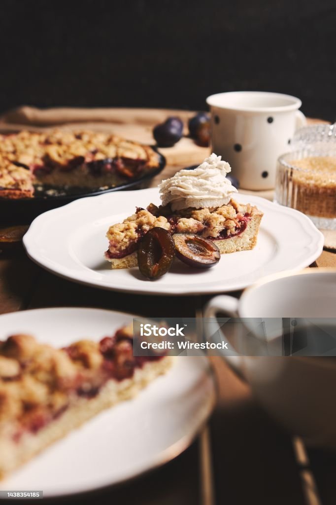 Delicious  Plum pie with Chemex coffee and ingredients with fabric on a wooden table with fabric The delicious  Plum pie with Chemex coffee and ingredients with fabric on a wooden table with fabric background Baked Stock Photo