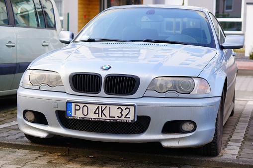 Poznan, Poland – March 08, 2020: Front of a parked BMW car with Polish license plate on a parking spot.