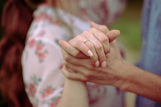istock Bride and groom exchange rings at the wedding. 1438357782