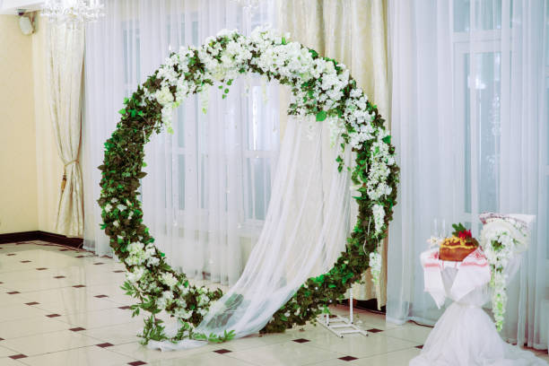 istock Wedding ceremony. wedding arch, decorated with various fresh flowers 1438357855