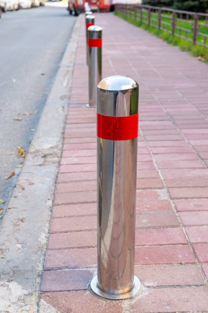 istock Stainless parking poles separating the sidewalk from the road. 1438359101