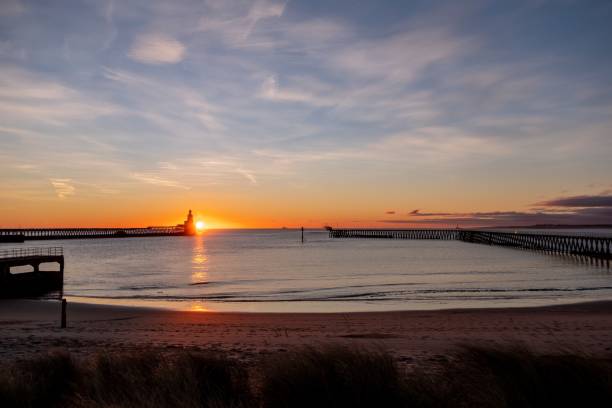 istock Scenic sunset with a glowing sun captured at the beach 1438360016