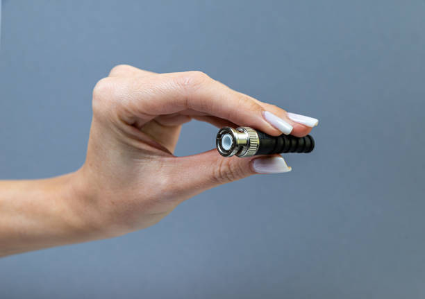 istock Hands holding various converter cables adapters for computers and smartphones 1438361062