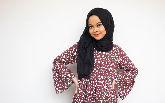 Portrait of asian hijab young woman on white background