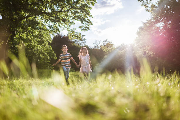 istock Beautiful children running in nature 1438371389