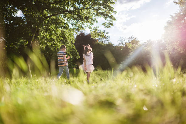 istock Beautiful children running in nature 1438371513