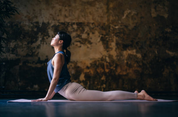 istock Happy Woman Practicing Yoga 1438371576
