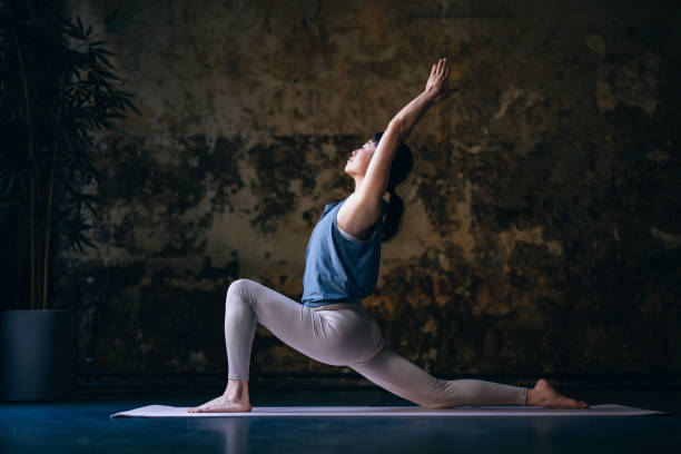 istock Beautiful Woman Practicing Low Lunge Pose 1438371578