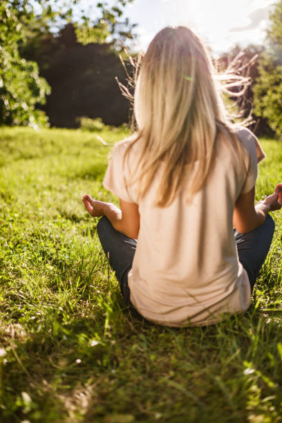 istock Woman doing yoga in nature 1438372133