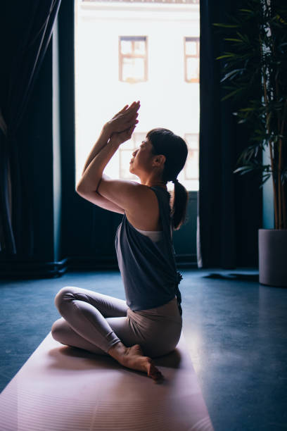 istock Side View Of Beautiful Woman Practicing Yoga 1438372200