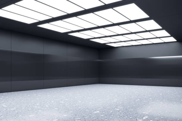 istock Perspective view on blank stone floor with place for product or car presentation in empty room with black walls and LED lights on ceiling. 3D rendering, mockup 1438373365