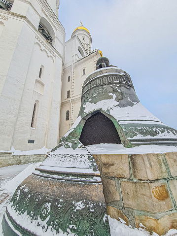 Wide-angle shot of a snow-covered Tsar Bell in the winter Red Square