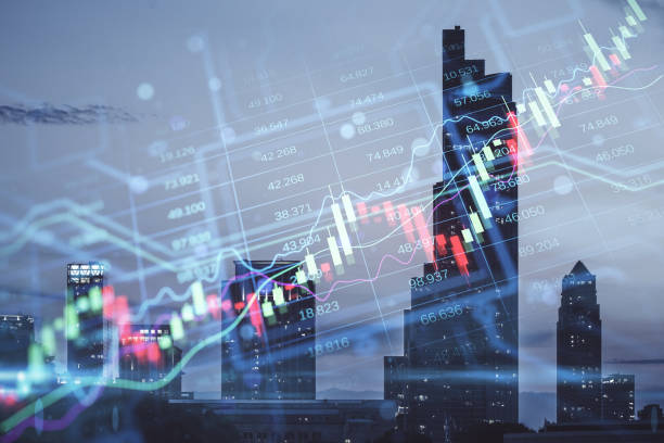 istock Creative candlestick forex chart index hologram on blurry night city buildings wallpaper. Trade, business market and finance analysis concept. Double exposure. 1438375106