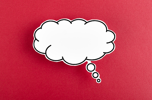 Speech bubble with copy space communication talking speaking concepts on red background.
