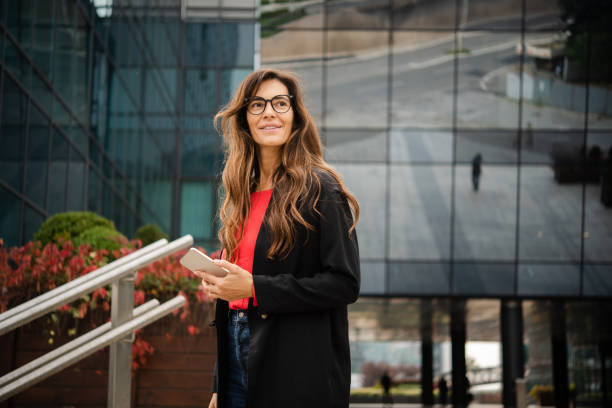 istock Beautiful businesswoman on a break using smartphone 1438376648
