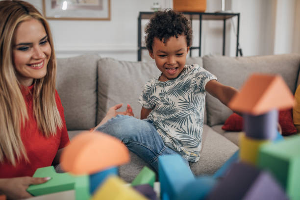 istock Mother and son playing with toys 1438376875