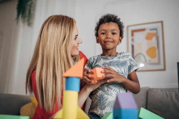 istock Mother and son playing with toys 1438382237